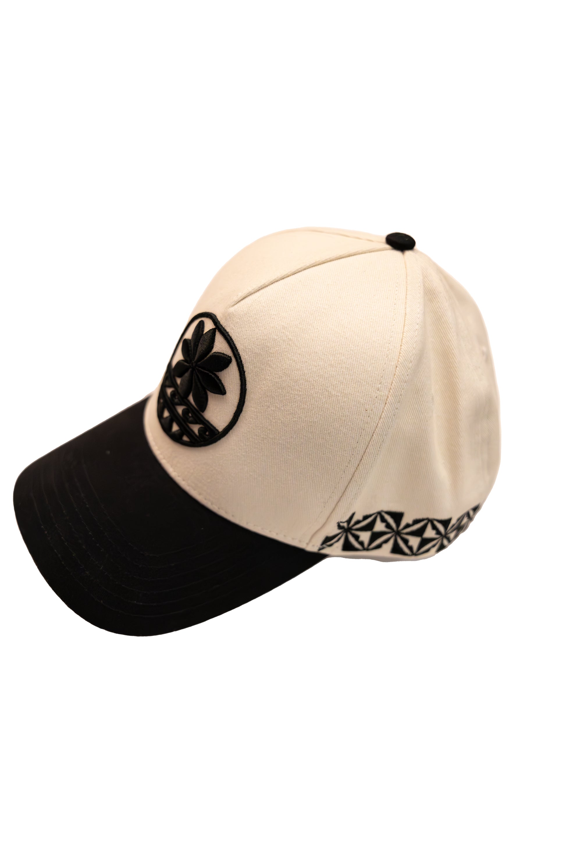 Two-tone cap with black and beige colors on a white background
