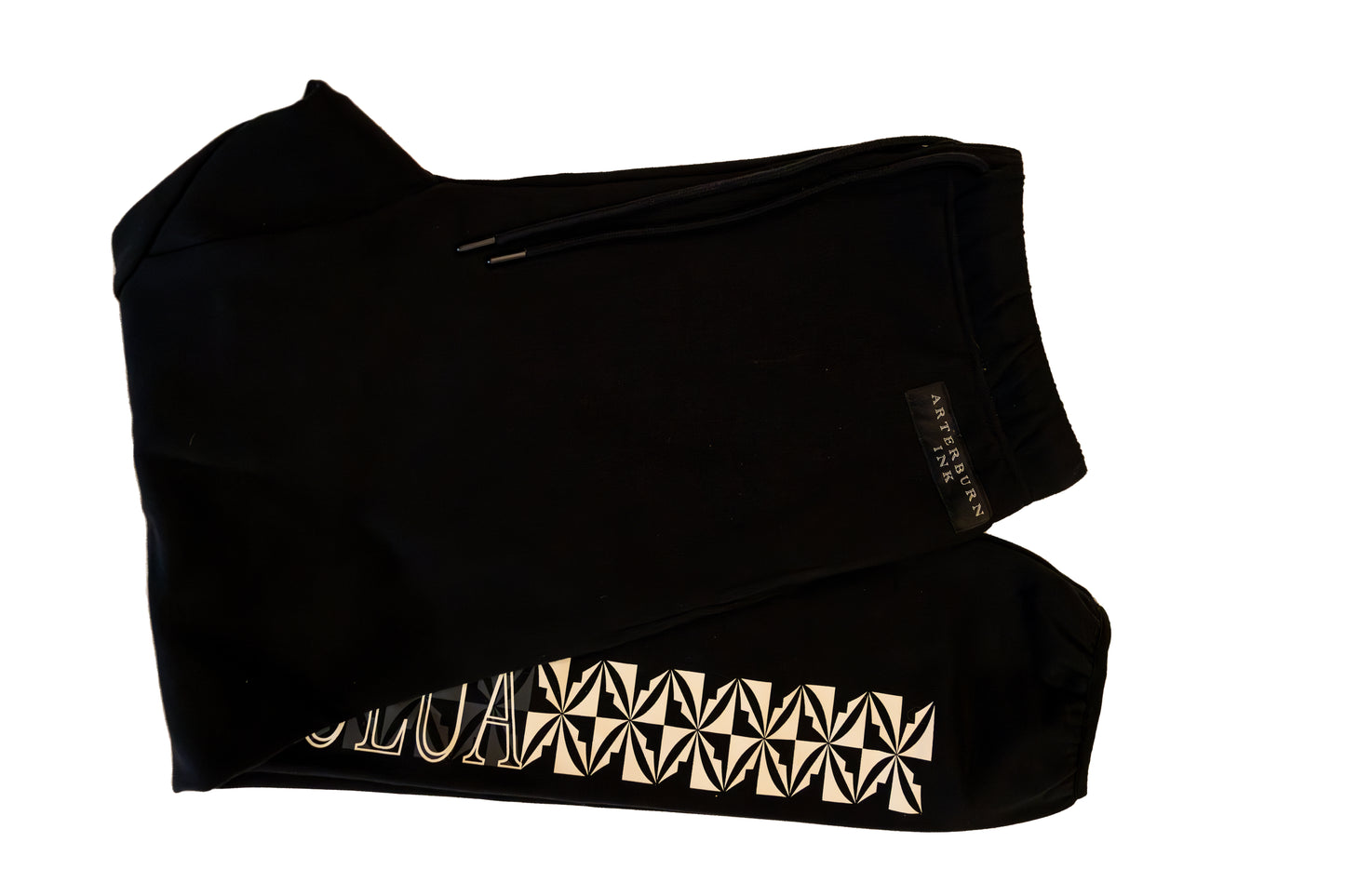 Black top with gold geometric pattern on a white background