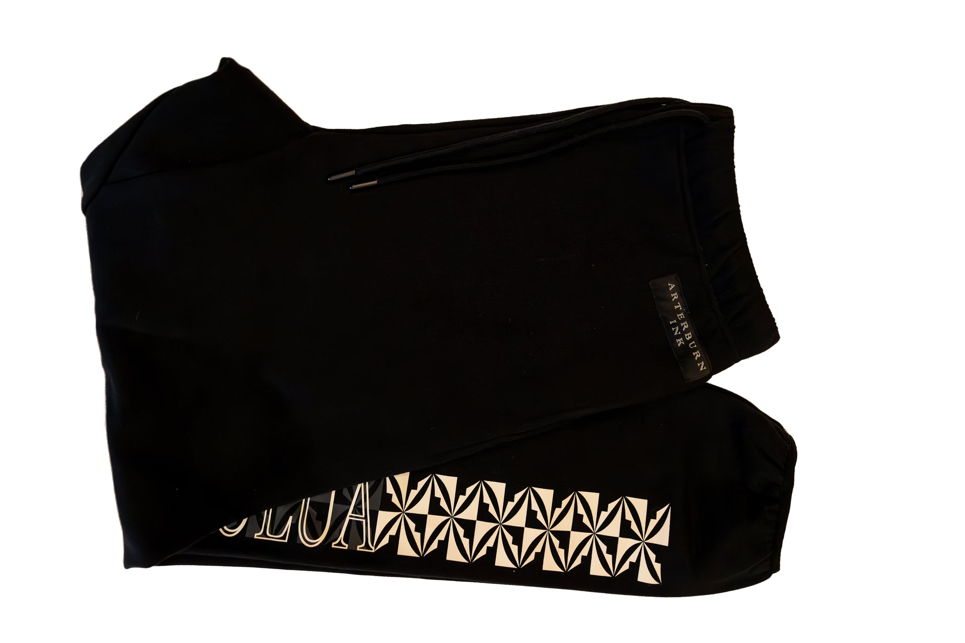Black top with gold geometric pattern on a white background